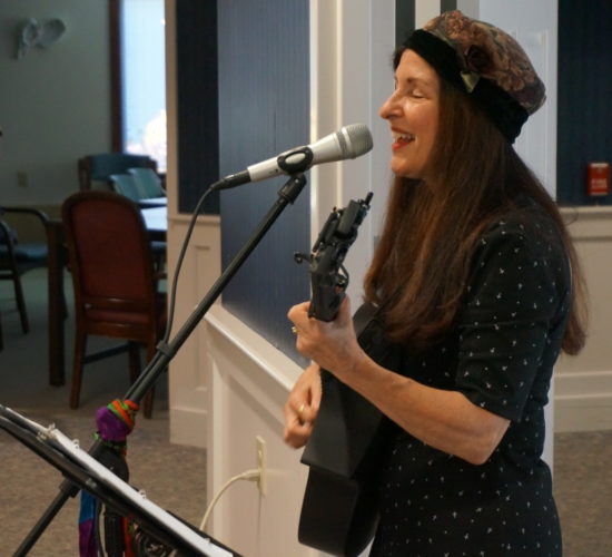 A singer-songwriter performs for residents at Mayo Healthcare.