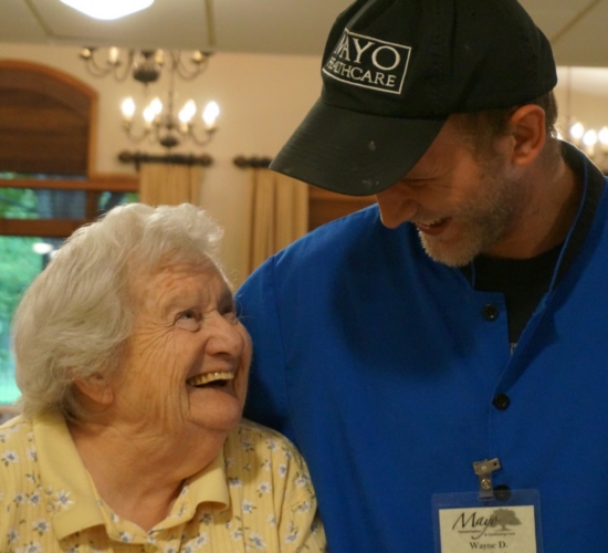 A mayo resident and staff member share a moment.